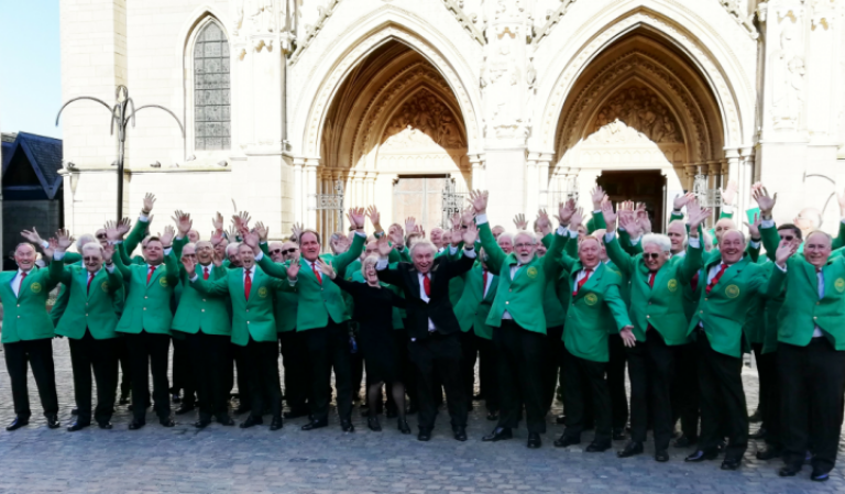 Romsey male voice choir having a group photo.