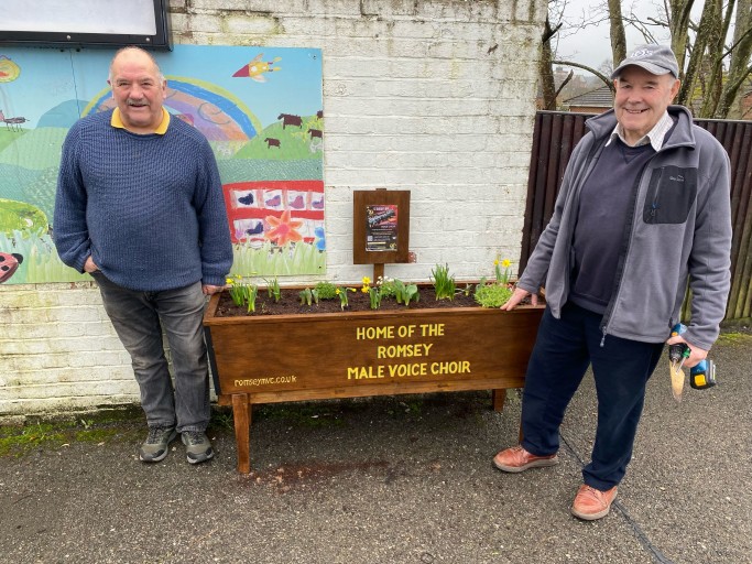 Peter and Ron putting the planter in place.