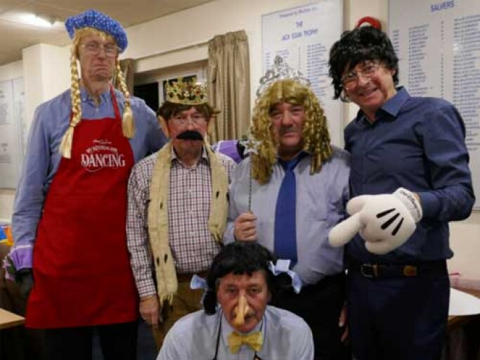 Group of men in fancy dress.