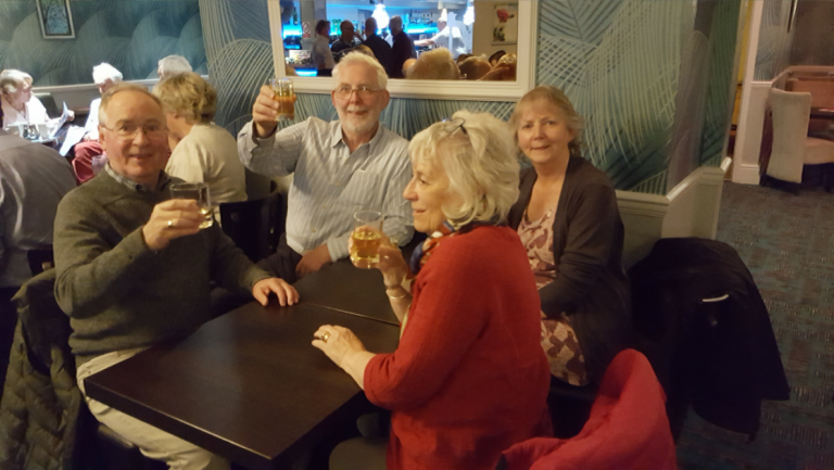 Group of people having drinks and having fun.